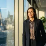 Stacy Brown-Philpot standing in a modern office environment.